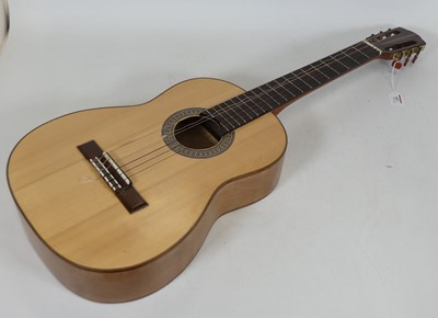 Lot 447 - A six string classical acoustic guitar,...