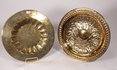 Lot 425 - An Indian chased brass tray, decorated with...