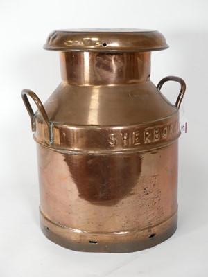 Lot 427 - An early 20th century Desco copper milk churn...