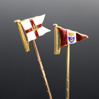 Lot 2018 - Two yellow metal enamel naval stick pins. One...
