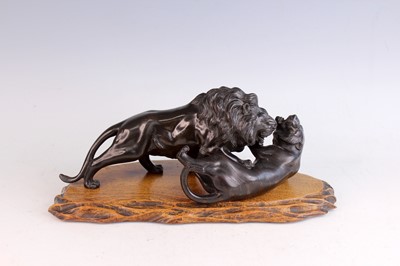Lot 11 - A Japanese bronze figure of two felines by...