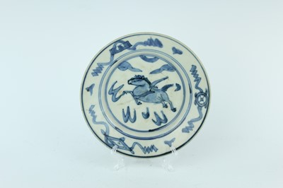Lot 36 - A Chinese blue and white ‘fire horse’ dish,...