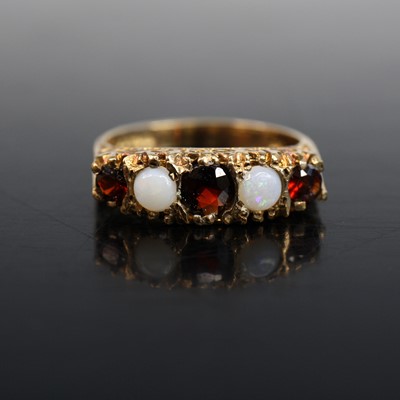 Lot 2023 - A 9ct yellow gold, garnet and opal half...