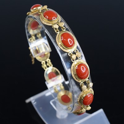 Lot 2026 - A yellow metal coral bracelet, featuring ten...