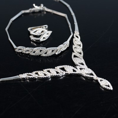 Lot 2067 - A white metal necklace, earring and bracelet...