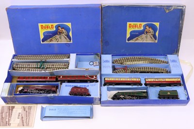 Lot 332 - Two Hornby Dublo 3-rail sets, with pre-war box...