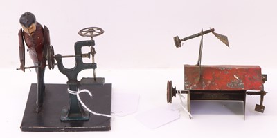 Lot 959 - Two Weedon tinplate mechanical toys. Worker...
