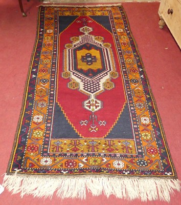 Lot 1404 - An Anatolian yahyali rug, 111cm x 257cm