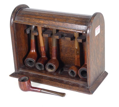 Lot 523 - An oak tambour front pipe rest, the...