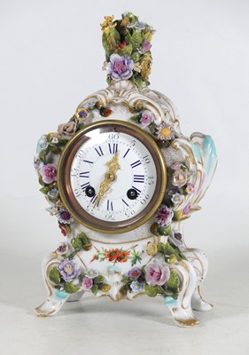 Lot 5 - A German floral encrusted porcelain mantel...