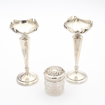 Lot 241 - A pair of George V silver posy vases, each...