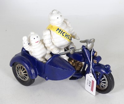 Lot 519 - A reproduction cast metal Michelin man...
