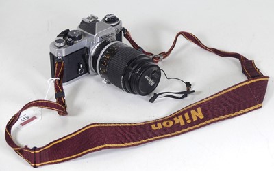 Lot 517 - A Nikon FE SLR camera body, serial number...