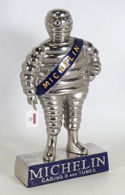 Lot 32 - A reproduction polished metal figure of the...