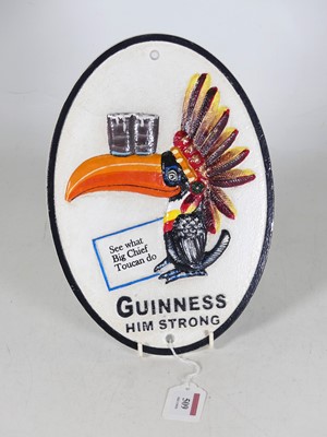 Lot 509 - A contemporary cast metal oval Guinness style...
