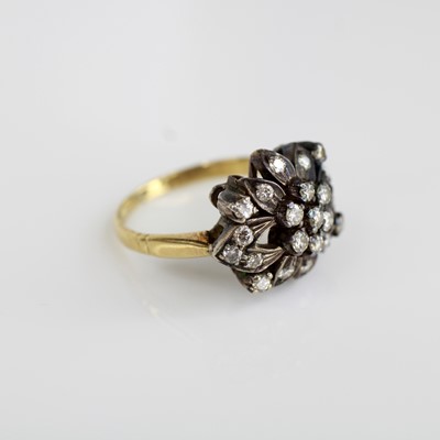 Lot 2028 - A yellow and white metal diamond floral...