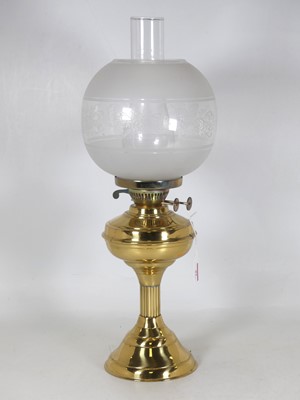 Lot 81 - A 20th century oil lamp, having an acid-etched...