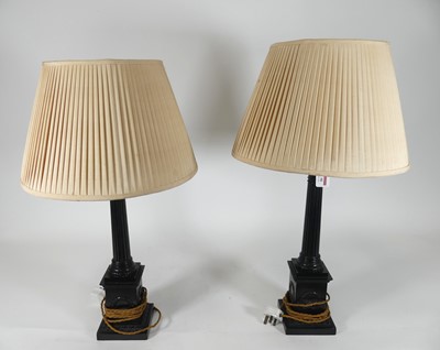 Lot 90 - A near pair of black painted composite...