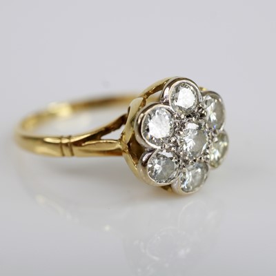 Lot 116 - An 18ct yellow and white gold, diamond daisy...