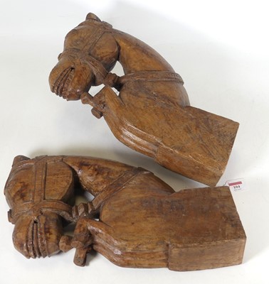 Lot 104 - A pair of Indian carved teak brackets, in the...