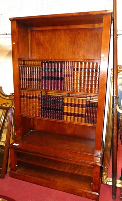 Lot 1142 - A contemporary cherry wood free standing open...