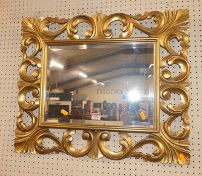 Lot 1131 - A Rococo style gilt composition framed and...