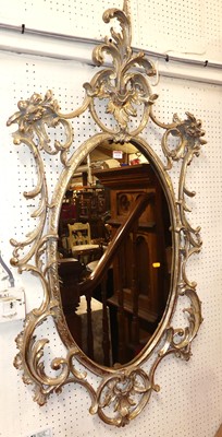 Lot 1133 - A Rococo style gilt composition framed swept...