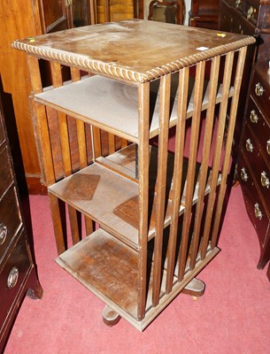Lot 1150 - An early 20th century oak square revolving...