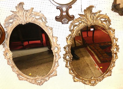 Lot 1164 - A pair of floral carved and pierced framed...