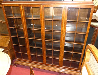 Lot 1175 - A large 1920s figured walnut four door glazed...