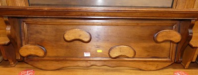 Lot 1177 - A stained walnut wall mounted coat rack with...