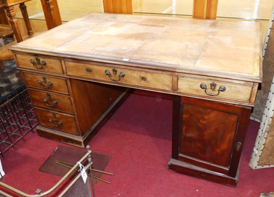 Lot 1188 - A circa 1900 mahogany partner's desk having a...