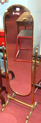 Lot 1195 - A gilt brass cheval mirror