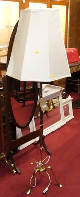 Lot 1196 - A gilt brass standard lamp raised on a knopped...