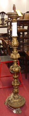 Lot 1198 - A floral carved and pierced gilt wood standard...