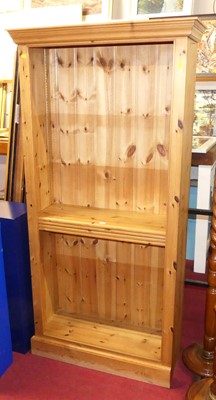Lot 1201 - A contemporary pine free standing open book...