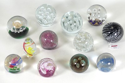 Lot 173 - A collection of glass paperweights, various...