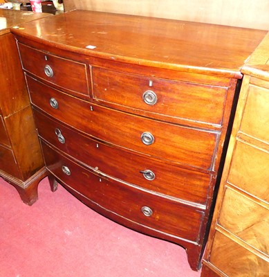 Lot 1209 - A Regency mahogany bowfront chest of two short...