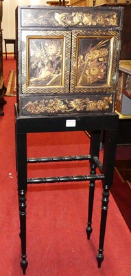 Lot 1226 - An Oriental black lacquered and gilt decorated...