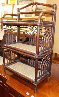Lot 1228 - A stained bamboo and cane inset three-tier low...