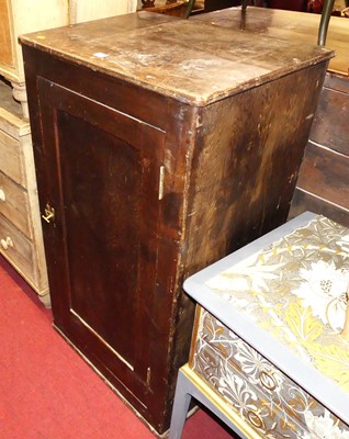Lot 1245 - A rustic pitch pine single door side cupboard,...