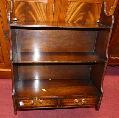 Lot 1248 - A contemporary mahogany three-tier wall shelf,...