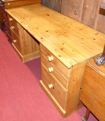 Lot 1254 - A contemporary pine kneehole writing desk,...