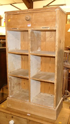 Lot 1264 - A rustic pine divisional shoe cupboard, having...