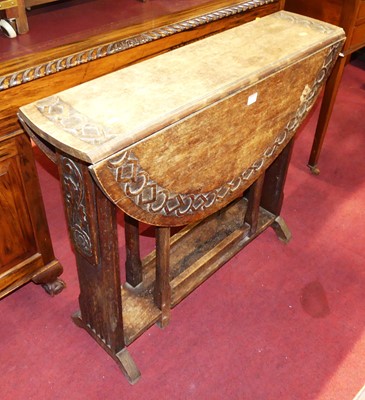 Lot 1270 - An early 20th century relief carved oak...