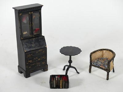 Lot 457 - A doll's house bureau bookcase, having black...