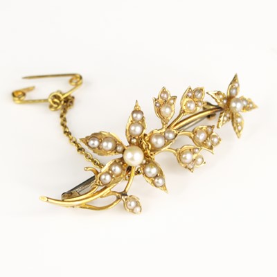 Lot 285 - An Edwardian 15ct gold seed pearl set leaf and...
