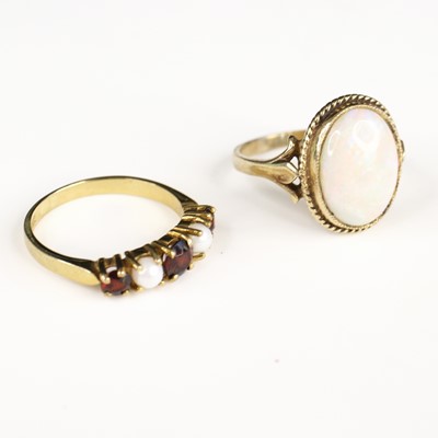 Lot 290 - A 9ct gold garnet and seed pearl set half-hoop...