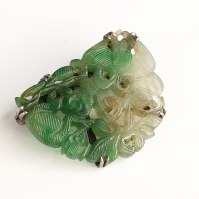 Lot 292 - An Art Deco carved pale and celadon jade...