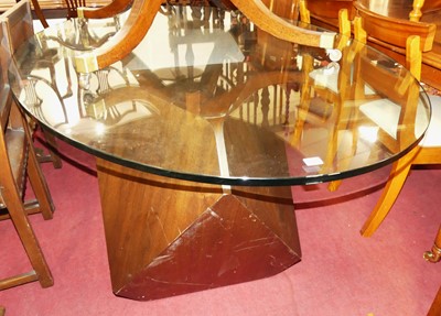 Lot 1284 - A contemporary oval plate glass topped dining...